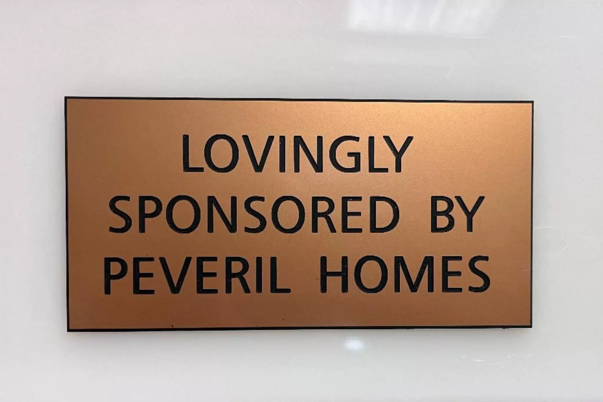 a sign that reads "lovingly sponsored by peveril homes"